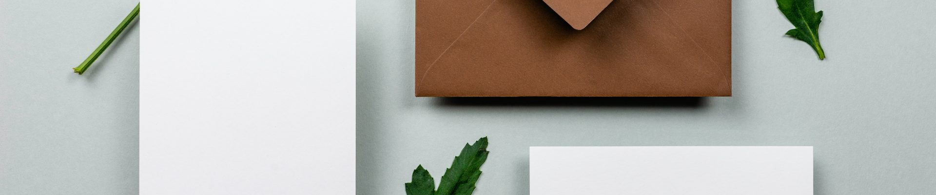 brown envelope beside white paper