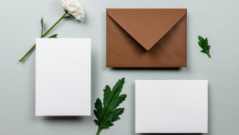 brown envelope beside white paper
